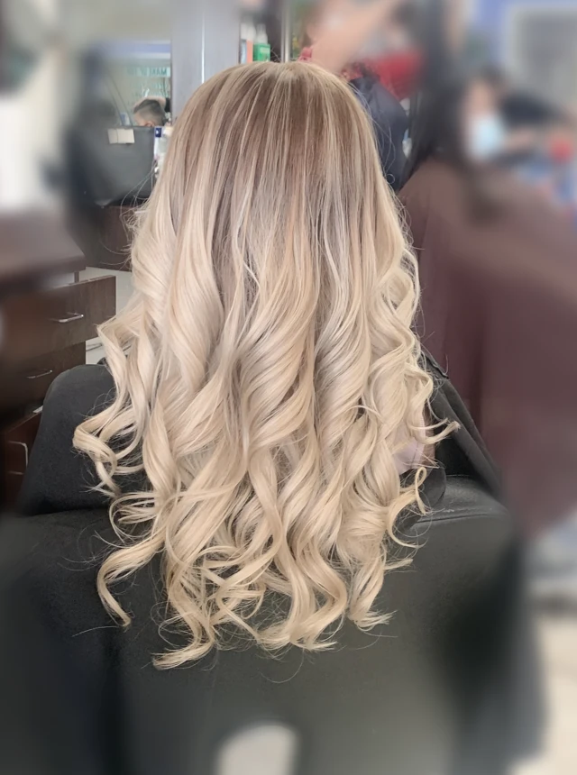 Long pale blonde curls viewed from behind